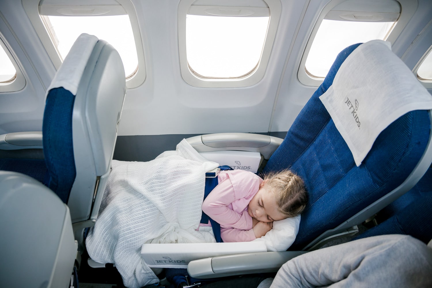 What travel accessories can my child bring on board? Can they sit in a car seat?
